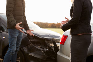 Picture of two individuals involved in a car accident