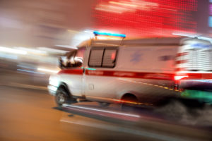 Photo of an Ambulance Rushing the Victim of an Auto Accident to the Hospital