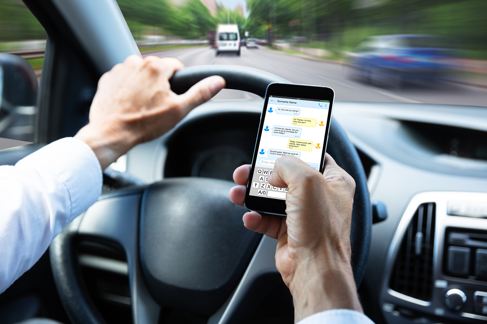 Photo of a driver texting while driving